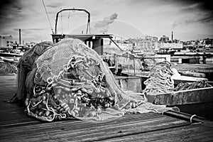 Fishing Net accumulated on a berth on Taranto Indusrtial Site Background