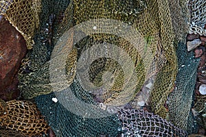 A fishing net is a net used for fishing. Nets are devices made from fibers woven in a grid-like structure. Some fishing