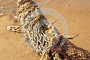 A fishing net washed up on the seashore. Baltic sea, Hel Peninsula, Poland