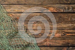 Fishing net on wooden background,