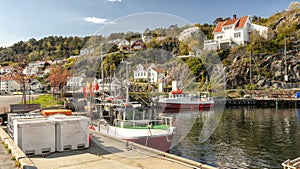 Fishing nets, colorful buoys on the quay of the Norwegian marina