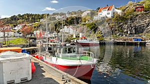 Fishing nets, colorful buoys on the quay of the Norwegian marina