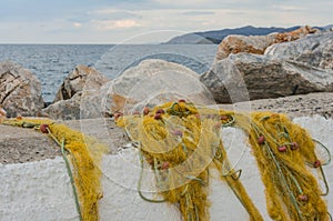 Fishing nets on a concrete pier by the sea