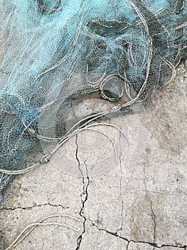 Fishing nets drying in the sun.Trawl of fisherman or net on the shore at fisherman village before storm.