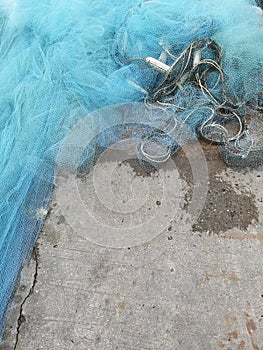 Fishing nets drying in the sun.Trawl of fisherman or net on the shore at fisherman village before storm.