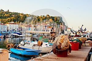 Fishing nets lie on the background of the city pier. The City Of Piran , Slovenia.