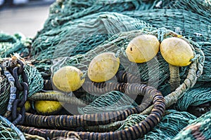 Fishing nets lying on the wharf at sunrise at the port of Norway