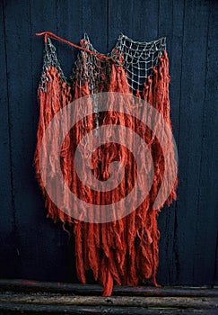 fishing nets in orange open dark blue background