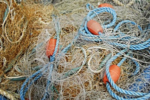 Fishing nets and sea ropes with buoys in the harbor.
