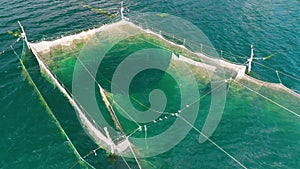Fishing Nets in the sea water near the coast of the Black Sea in Varna, Bulgaria, aerial drone view.