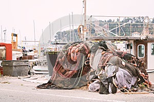 Fishing nets stacked on the waterfront