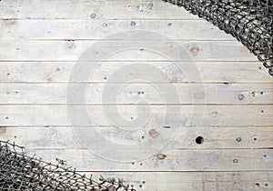 Fishing nets still-life on the wooden background.