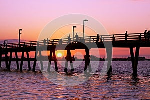 Fishing off the pier at Sunset