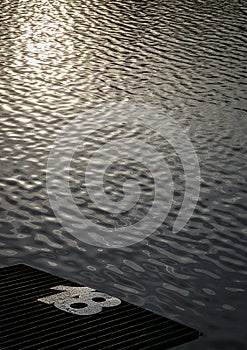 Fishing peg number eighteen with shimmering sunset water in background