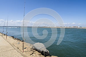 Fishing from the pier on Atlantic Ocean in Isla Canela in Andalusia, Spain