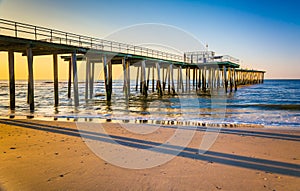 Fishing pier and the Atlantic Ocean at sunrise in Ventnor City,