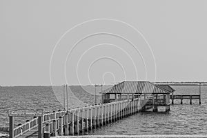 Fishing pier in black and white on the Mississippi Gulf Coast. Biloxi, Gulf of Mexico, Harrison County, Mississippi USA