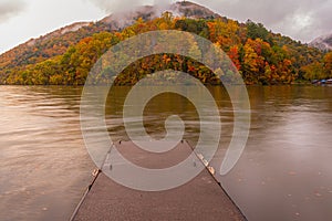 Fishing Pier On The Bluestone River Surrounded With Fall Foliage