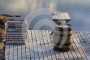 Fishing pier with a cod liver oil barrel and lobster pots