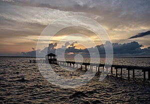 Fishing pier and dock at sunset