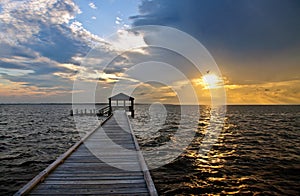 Fishing pier and dock at sunset