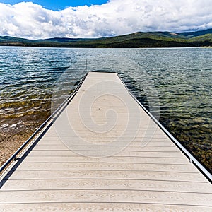 Fishing Pier Extending Onto Alpine Lake