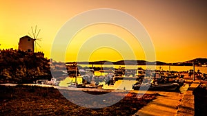 Fishing pier with ships in evening