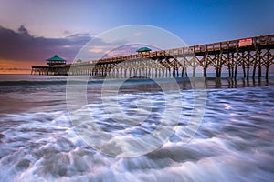 The fishing pier at sunrise, in Folly Beach, South Carolina.