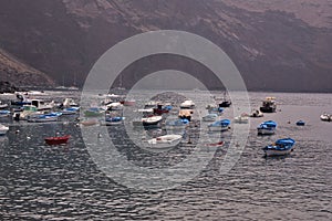 Fishing and pleasure boats moored off the coast