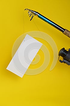Fishing pole with a blank piece of paper