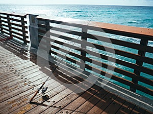 Fishing Pole on Pier on Ocean