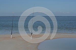 Fishing poles on Fernandina Beach, Cumberland Sound, Fort Clinch State Park, Nassau County, Florida USA