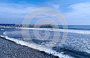 Fishing port with spectacular blue ocean with foam. Port of La Libertad, El Salvador photo