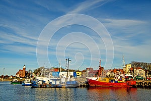 Fishing port of Ustka with old lighthouse photo