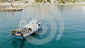 Aerial view of the arrival to port of the trawler fishing boats. photo