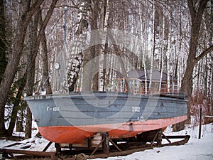 Fishing recreation center. retro boat. winter