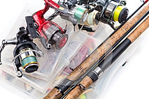 Fishing reels and rods on storage boxes