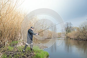 Fishing on the river bank