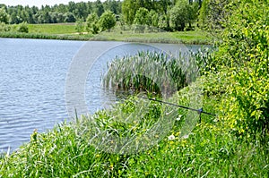 Fishing rod on the background lake