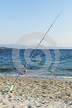 Fishing rod on beach shore