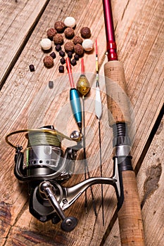 Fishing rod with a cortical handle and a fishing reel. A variety of floats. Fishing bait from boilies and pellets