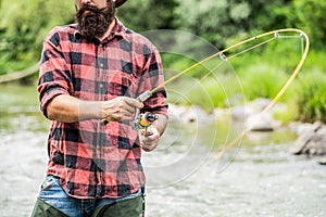 Fishing rod lake fisherman men sport summer. Fisherman with rod fishing on the lake. Fishing. Fisherman and trout. Fly