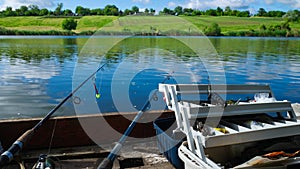 Fishing with a rod on the lake. Fishing tackle. Fishing from the shore for crucian.