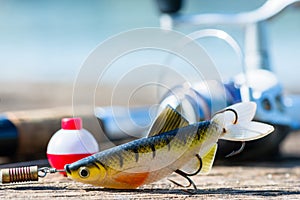 Fishing rod, lure, and hook on jetty