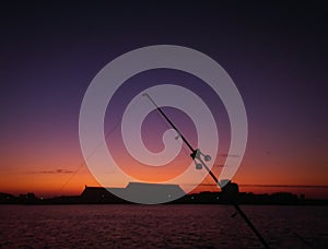 Fishing rod in the midst of sunset