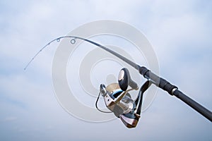 Fishing rod with reel.