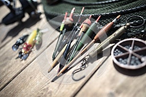 Fishing rod, reel, floats and tackle background
