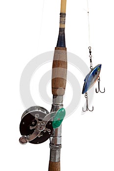 A fishing rod, reel and lure on a white background