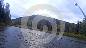 Fishing rod on the river in the afternoon outdoors