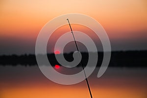 Fishing rod at sunset close-up